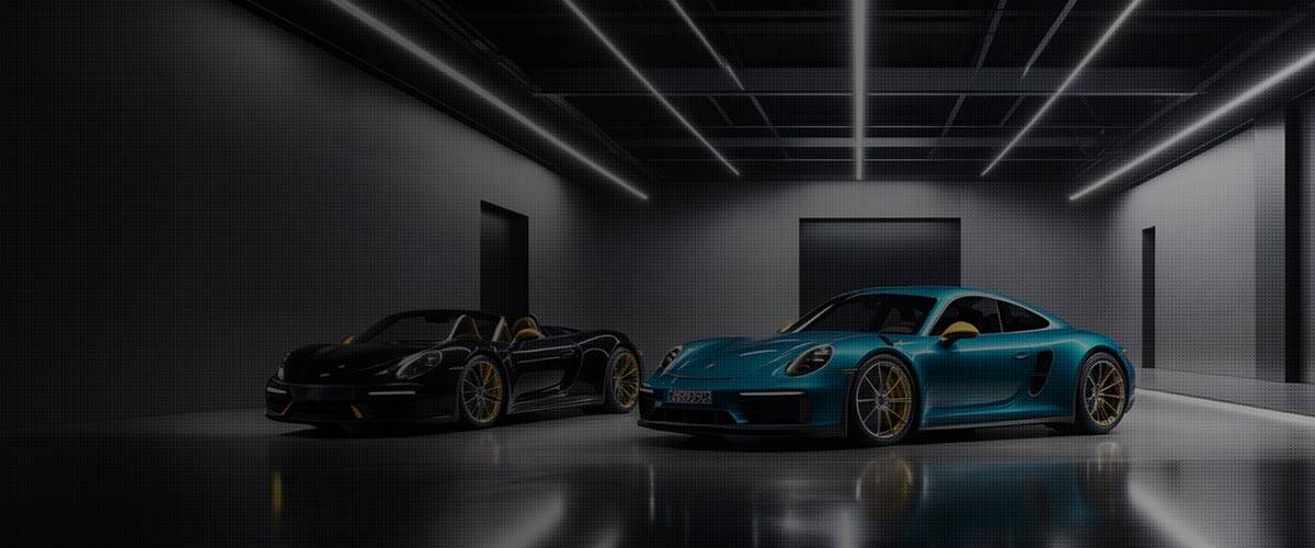 A group of exotic Porsche's in garage after collision repair